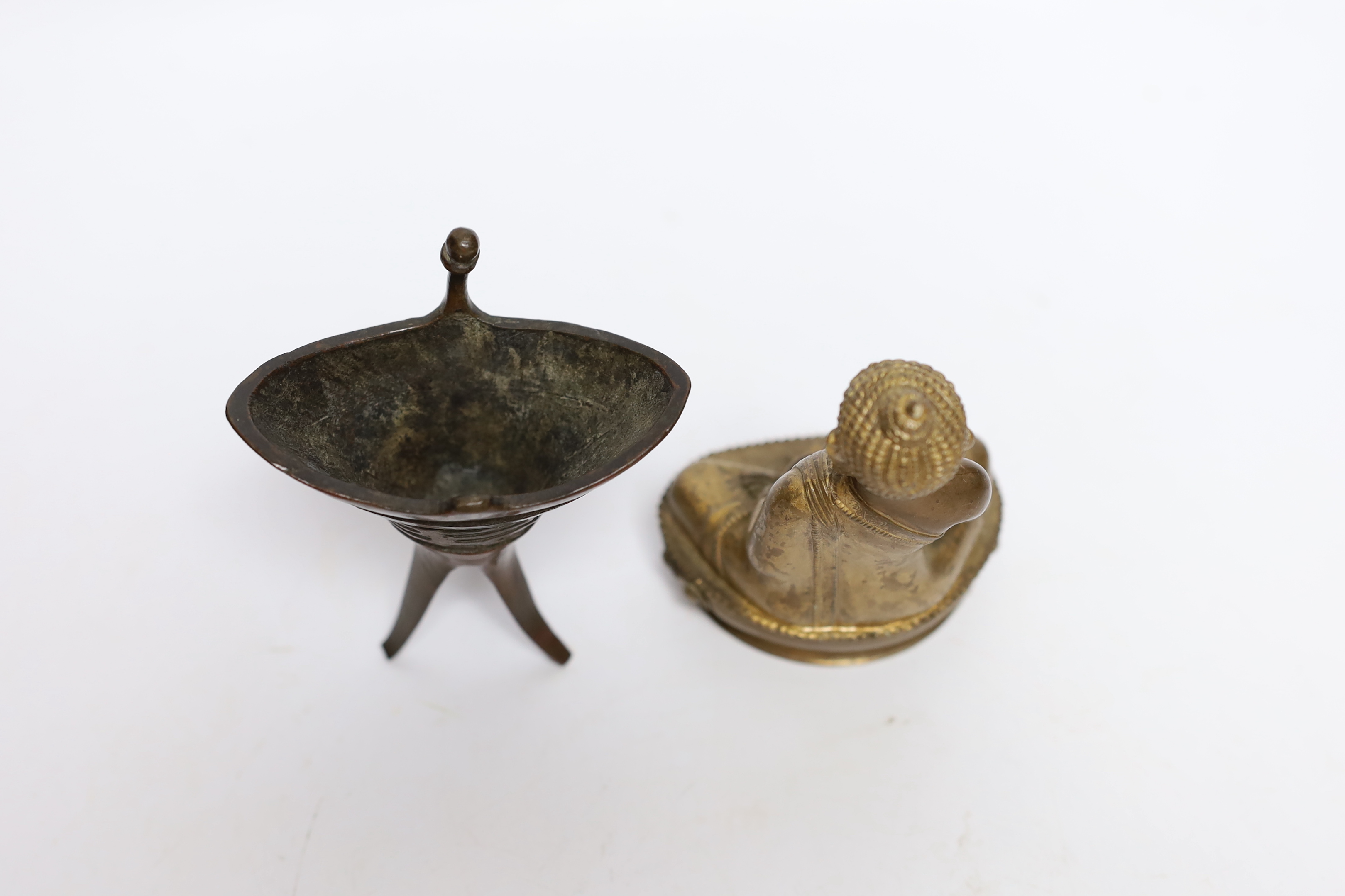 A Chinese archaistic bronze jue vessel and a bronzed plaster figure of Buddha, tallest 11.5cm